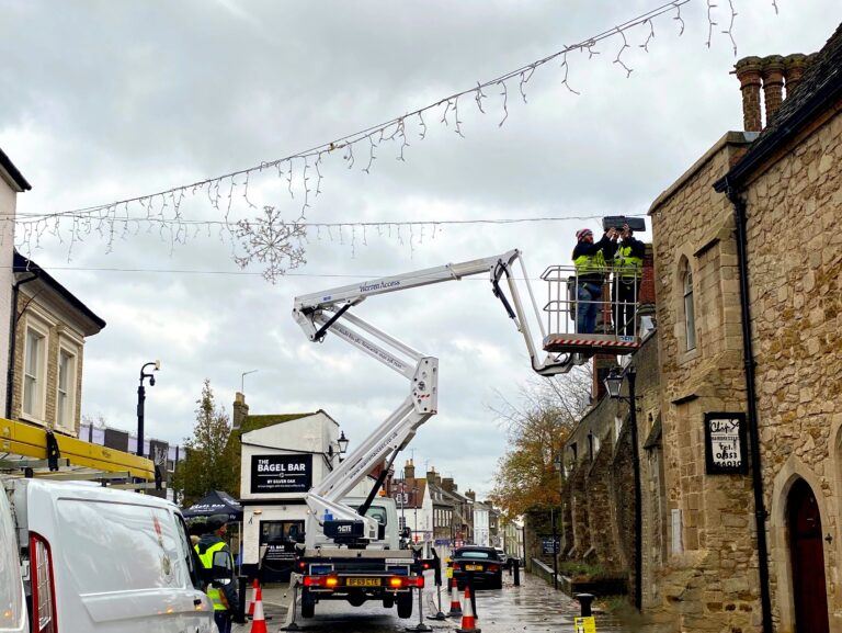 Warren Access truck mounted platform putting up Christmas decorations in Ely