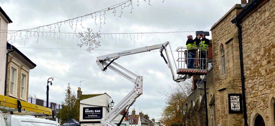 Warren Access truck mounted platform putting up Christmas decorations in Ely
