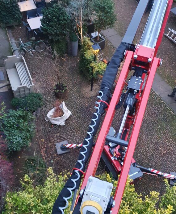 Warren Access trim ivy at The George of Stamford with the 17m Hinowa 17.75 spider lif,t part of the access platform hire fleet